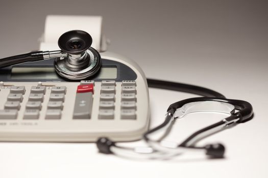 Black Stethoscope on a Calculator with Selective Focus.