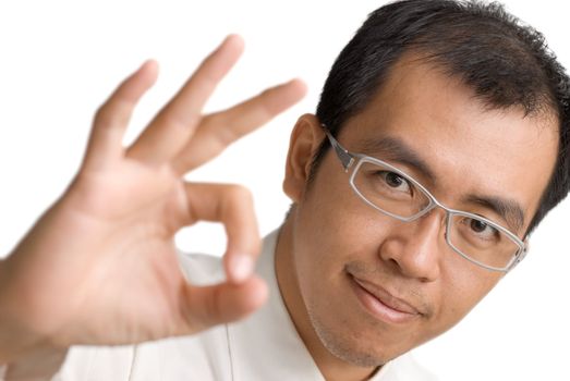 Gesture of OK with Asian business man on white background.