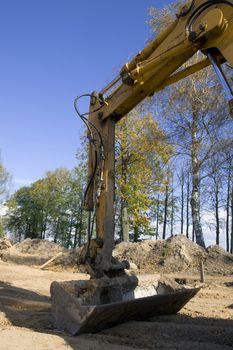 Excavator in actioin in building trade