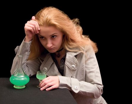 The long-haired girl with a wine-glass of absinthe liqueur