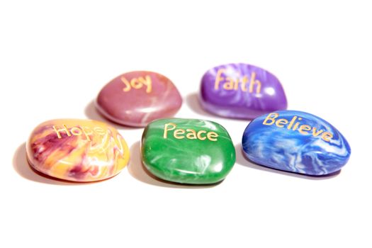 five stones inscribed hope joy peace faith and believe