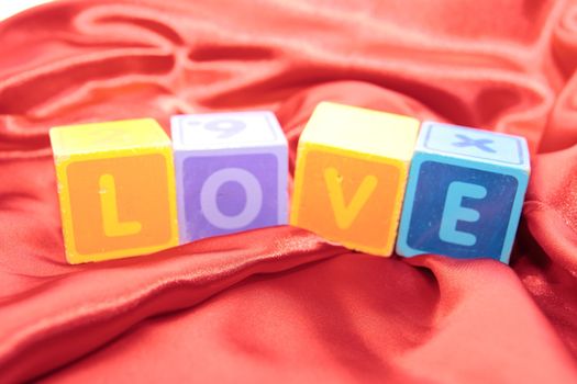 love written with blocks on a silk nightie