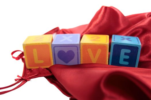 love written with blocks on a silk nightie
