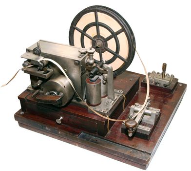 isolated obsolete vintage morse telegraph machine on white background