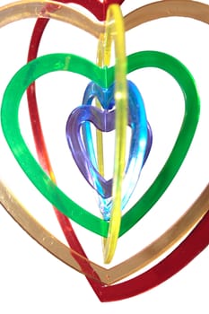 six heart shaped plastic pieces one inside the other on a white background