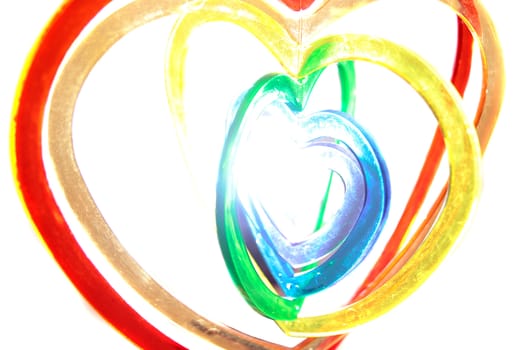 six heart shaped plastic pieces one inside the other on a white background