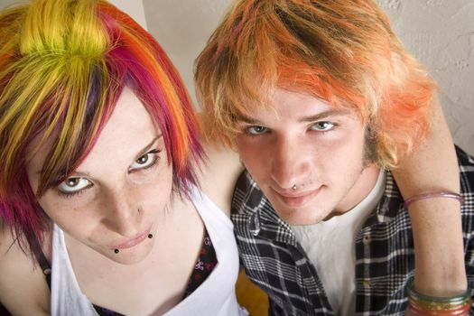 Portrait of Young Couple with Bright Colored Hair Embracing