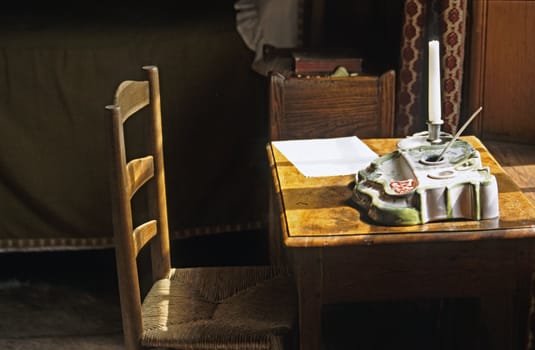 Still life with chair and desk set.