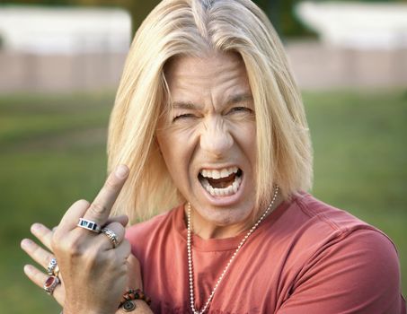 Rock and Roll Guy Making a Rude Gesture