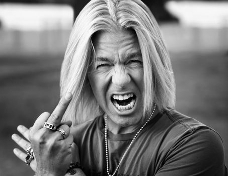 Rock and Roll Guy Making a Rude Gesture