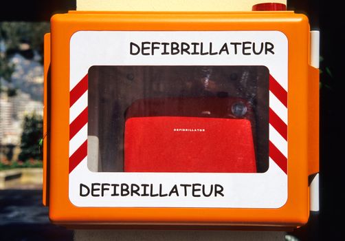 A defibrillator is posted to a wall outside a police station for emergencies in Monaco.