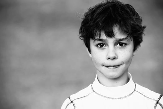 Portrait of a Young Teen Boy with Dark Curly hair