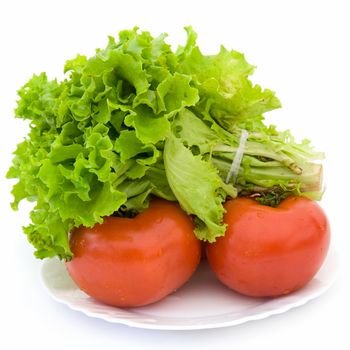 Lettuce and red tomatoes on a white background