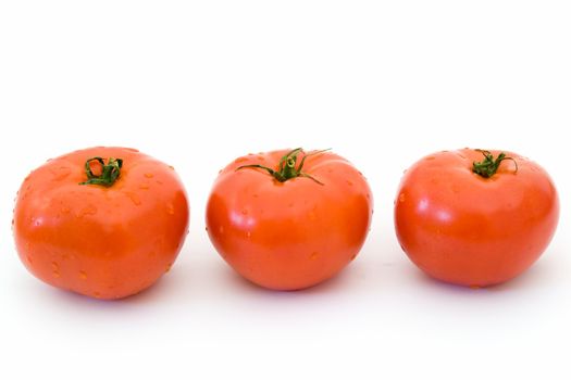 fresh red tomatoes on a white background