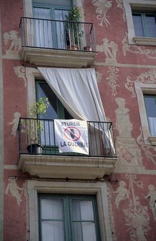 Protest banner declaring No War hanging from a balcony in Barcelona, Spain