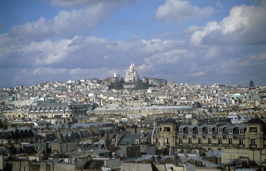 A view of the Sacre Coeur above the Parisian skyline.