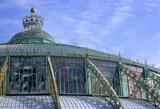 The domed roof of the Royal Greenhouse in Laeken (Brussels), Belgium is topped with a crown.