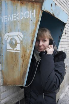 Upset girl with street phone