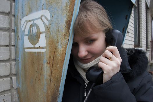 Upset girl with street phone