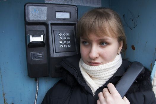 Upset girl with street phone