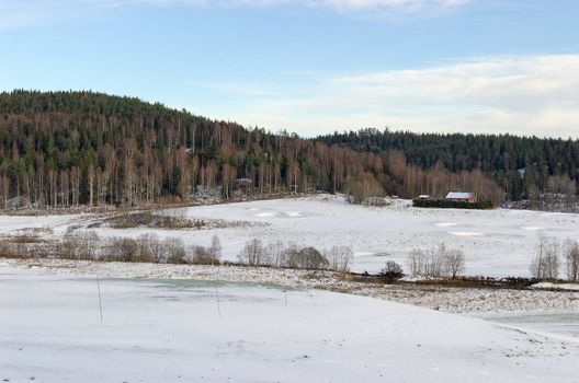 Open golf fields, covered by snow. Located in Losby, Norway
