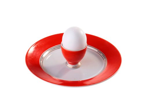Egg in specially support for eggs on a plate.