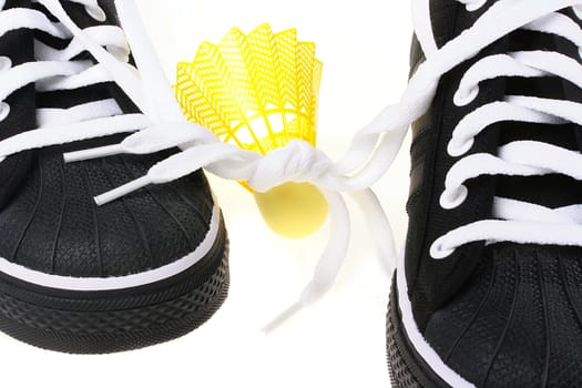 Black sports footwear with the connected laces and a flounce for game in badminton.
