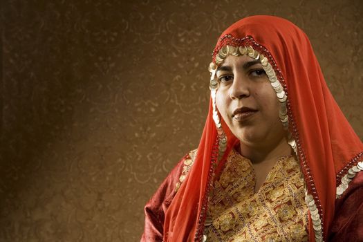 Portrait of a Muslim Woman in a Red Head Scarf