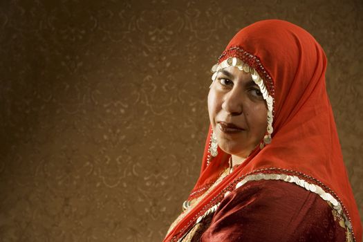 Portrait of a Muslim Woman in a Red Head Scarf