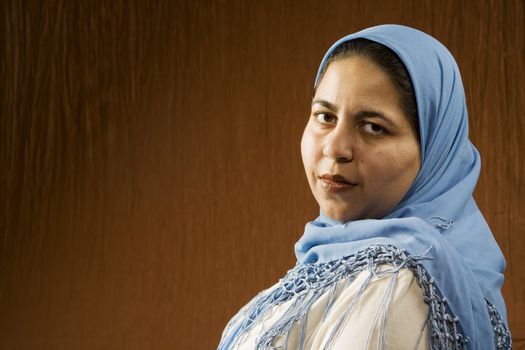 Portrait of a Muslim Woman in a Blue Head Scarf