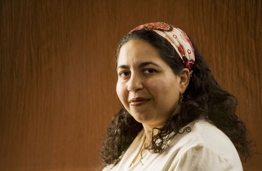 Portrait of a Muslim Woman in a Long Curly Black Hair