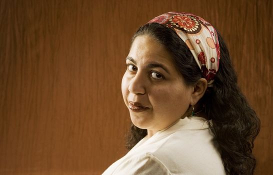 Portrait of a Muslim Woman in a Long Curly Black Hair