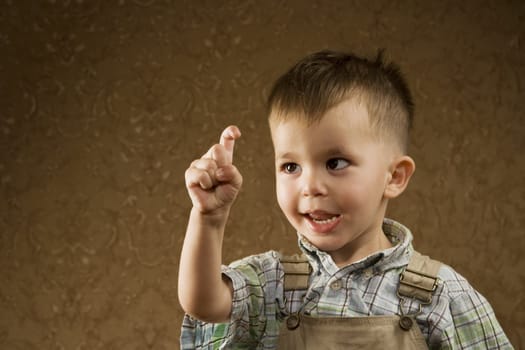 Portrait of a Happy Young Arabic boy Looking at his Finger