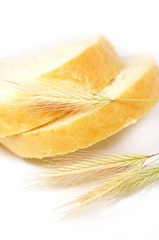 some slices of bread and wheat corns on white