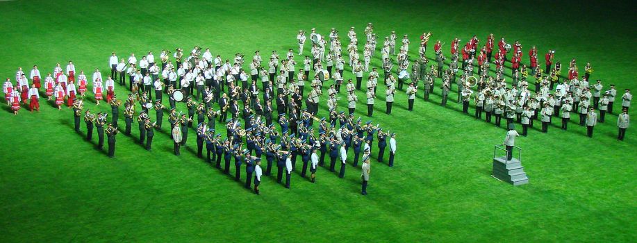 military orchestra band Marching and playing on green, grass, field