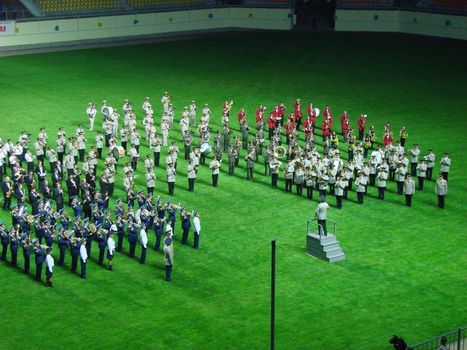 military orchestra band Marching and playing on green, grass, field