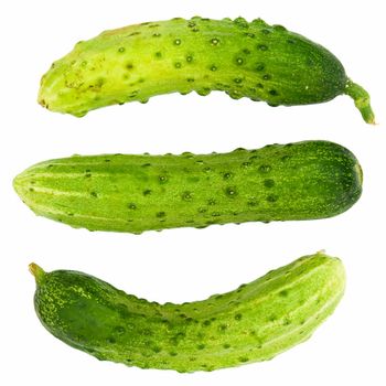 Three green cucumbers on a white background.