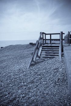 A blue toned view of s pebble beach