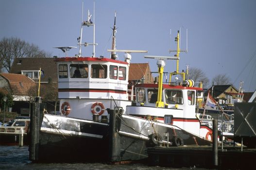 Two tug boats in Urk Harbor, the Netherlands. 