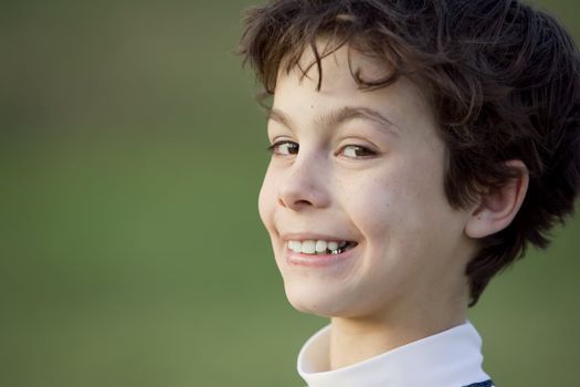 Handsome teenager with a broad smile on his face