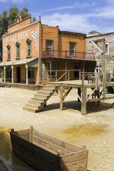 Western scenery with saloon. Vertical shot.