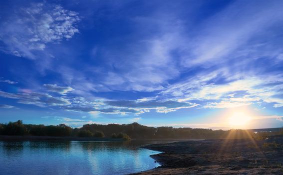 The sun had not yet quite fled over the horizon. The shore of the river. Summer. Beach.