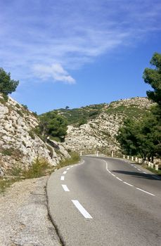 A winding road through the Alpille mountain range in southern France is a great road trip for drivers.