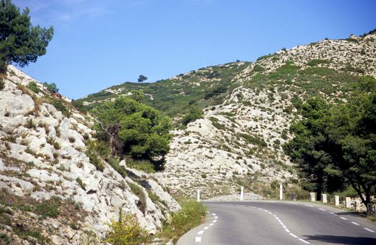 A winding road through the Alpille mountain range in southern France is a great road trip for drivers. 