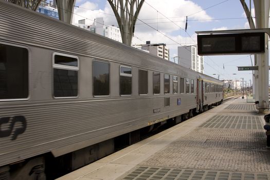 Lissbon train station with train in motion