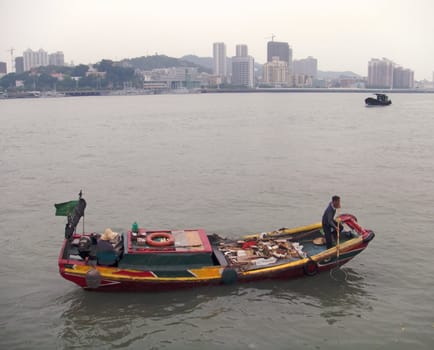 Fishing boat in Hong - Kong"s bay                