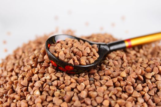 Russian wooden spoon with buckwheat groats removed close up