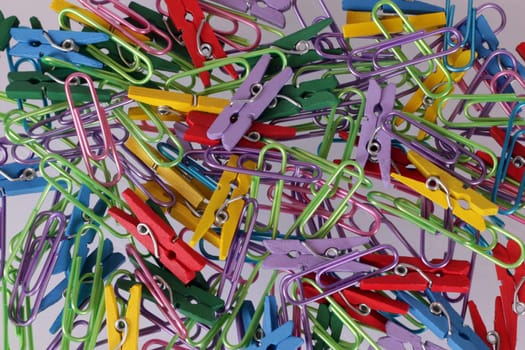 Close up of paper clips and pegs.