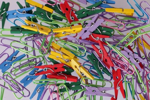 Close up of paper clips and pegs.