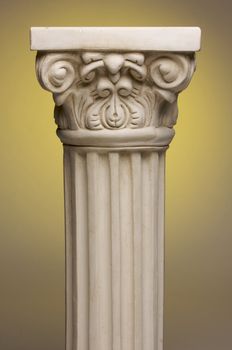 Ancient Column Pillar Replica on a Yellow Gradation Background.